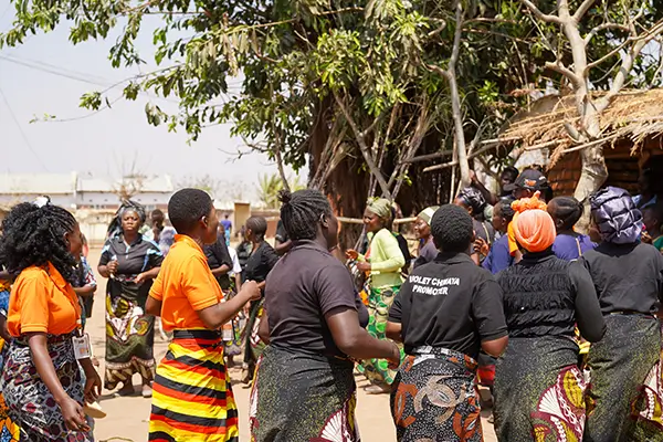 Members of savings groups in Mchinji, Malawi, welcomed VisionFund staff during a field visit